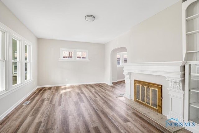 unfurnished living room with hardwood / wood-style floors