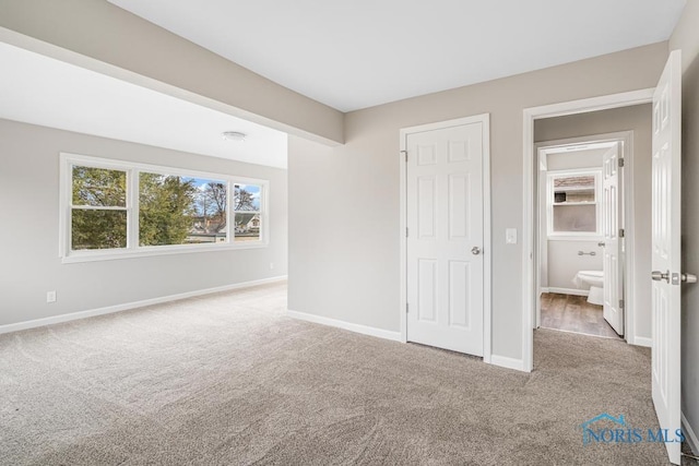 unfurnished bedroom featuring light colored carpet