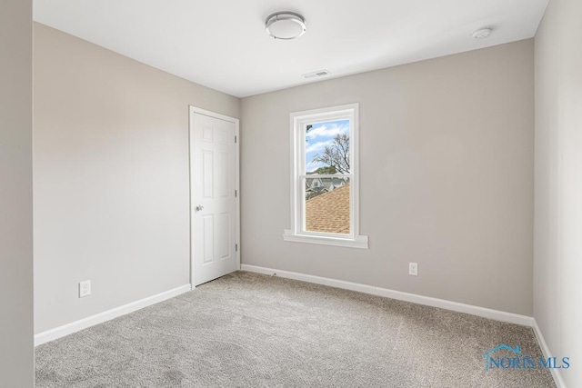 spare room with carpet flooring