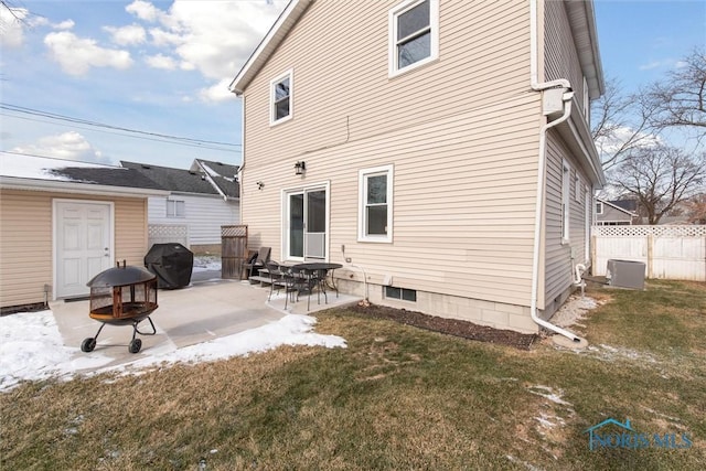 back of house with a patio area, a lawn, and an outdoor fire pit