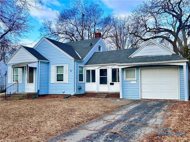 view of front of property with a garage