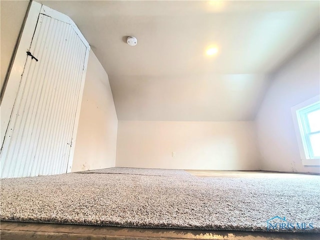 bonus room featuring vaulted ceiling