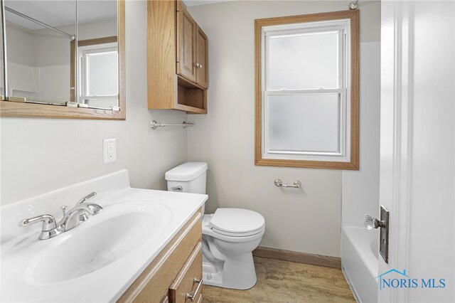 full bathroom featuring independent shower and bath, vanity, and toilet