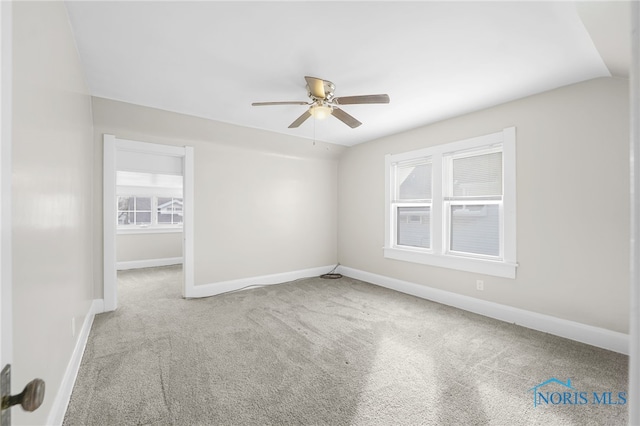 carpeted empty room with ceiling fan