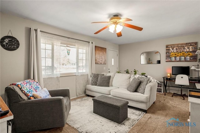 living room with carpet floors and ceiling fan