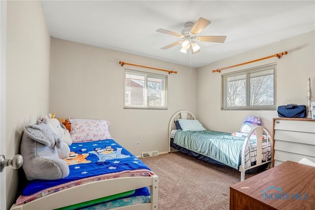 carpeted bedroom featuring ceiling fan