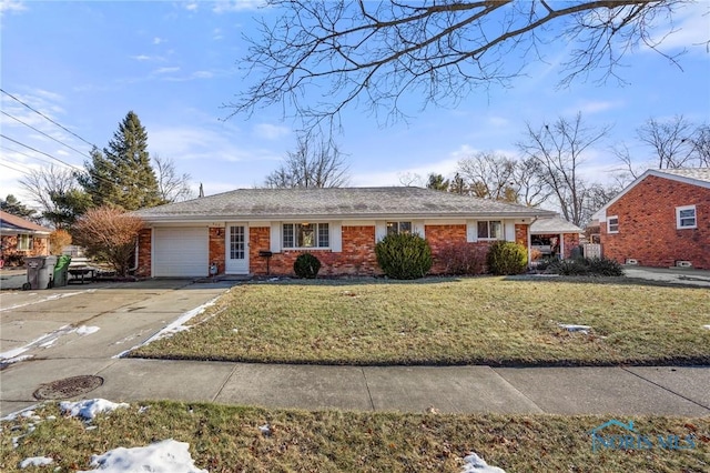 single story home featuring a garage and a front yard