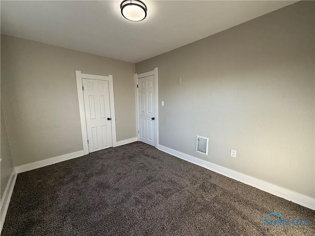 spare room with carpet flooring