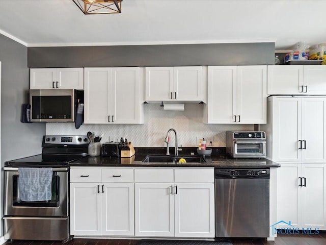 kitchen with stainless steel appliances, sink, and white cabinets