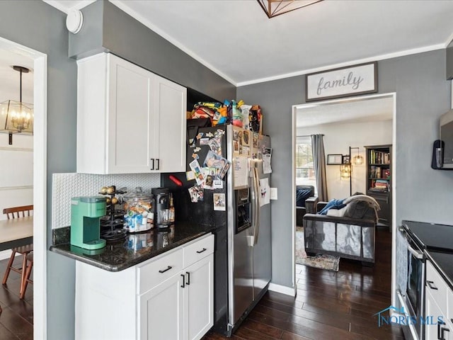 kitchen featuring white cabinetry, backsplash, dark wood-type flooring, and appliances with stainless steel finishes