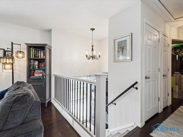 hallway featuring a chandelier