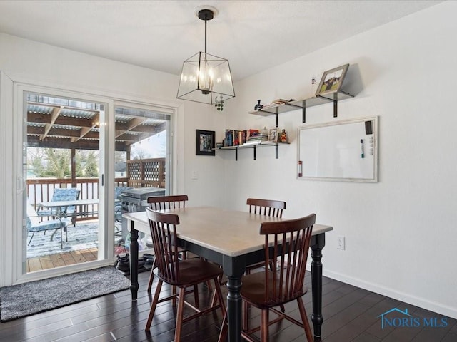 dining room with dark hardwood / wood-style flooring