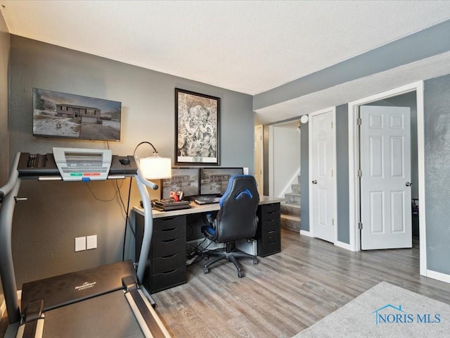 home office featuring hardwood / wood-style flooring