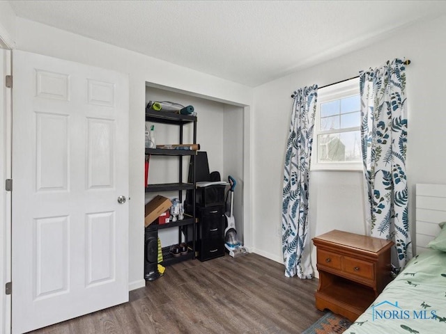 bedroom featuring dark hardwood / wood-style floors