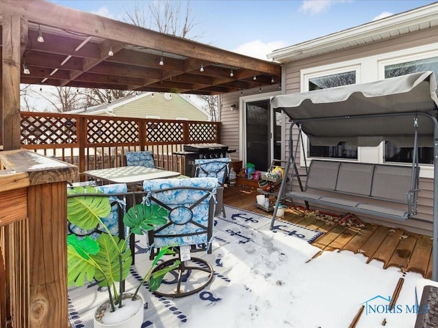 view of snow covered deck