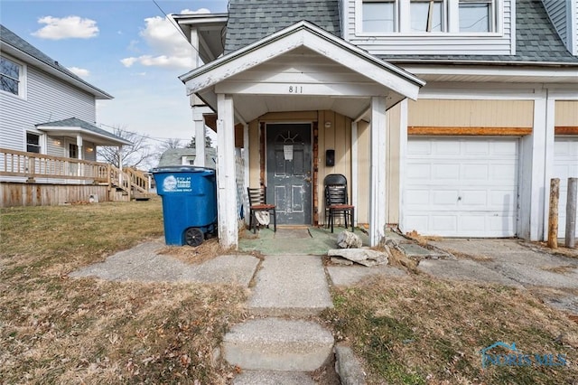 doorway to property featuring a garage