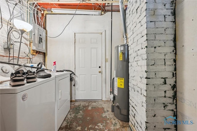 laundry room featuring gas water heater, electric panel, and washer and dryer