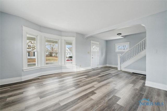 unfurnished living room featuring hardwood / wood-style floors