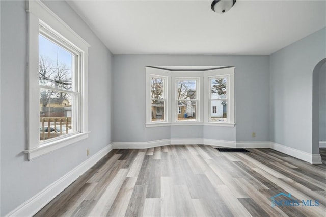 unfurnished room featuring hardwood / wood-style floors