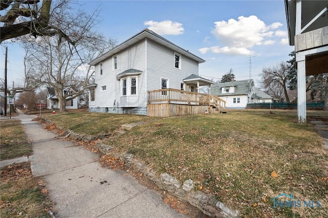 view of side of property with a lawn