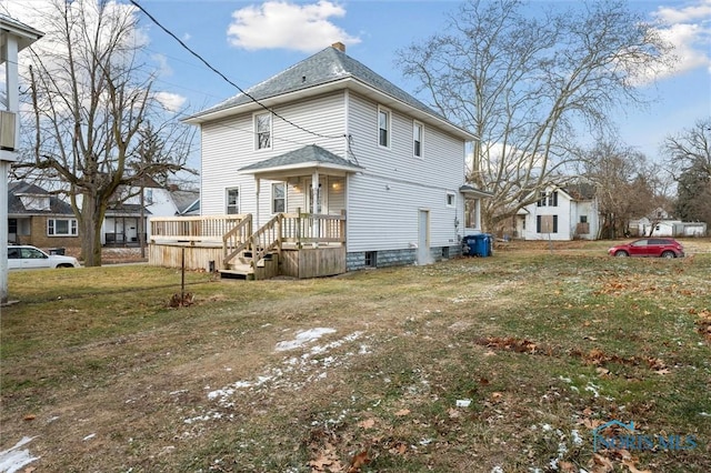 back of house featuring a yard