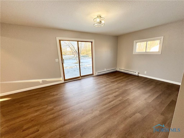 unfurnished room with a baseboard radiator, a textured ceiling, and dark hardwood / wood-style flooring