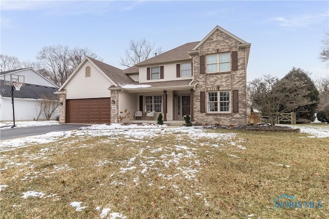 view of front of home featuring a yard and a garage