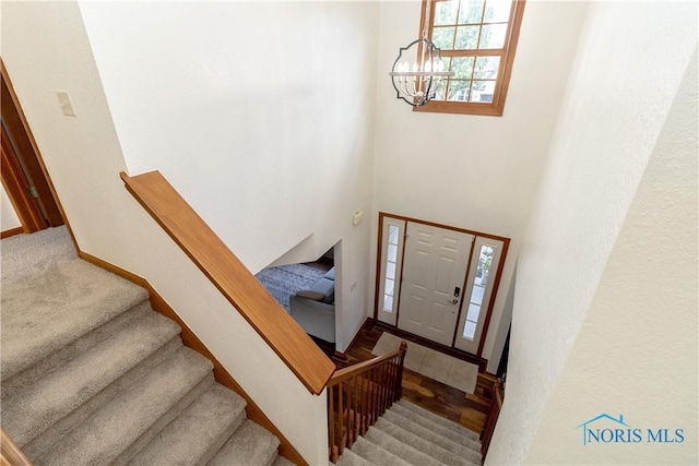 entrance foyer featuring an inviting chandelier