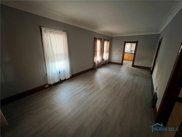 unfurnished room featuring hardwood / wood-style flooring