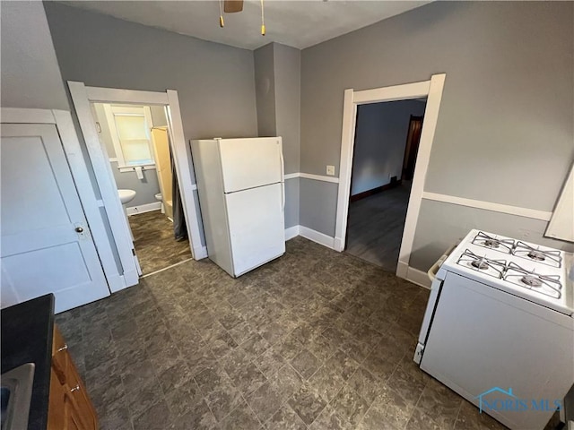 kitchen with white cabinetry, white appliances, and ceiling fan