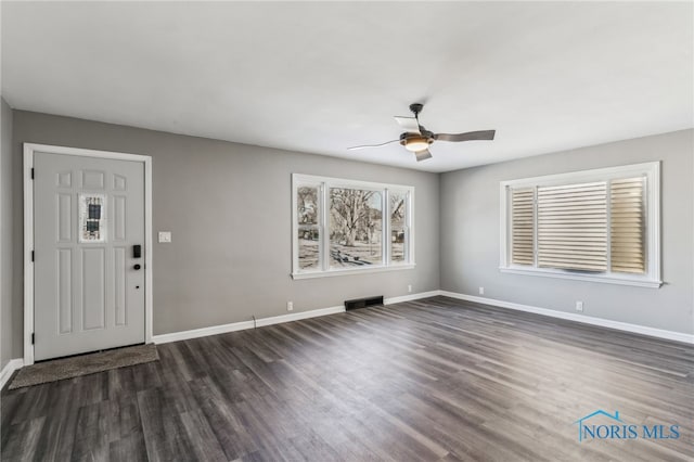 entrance foyer with dark hardwood / wood-style floors and ceiling fan