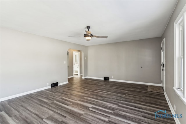 empty room featuring dark hardwood / wood-style floors and ceiling fan