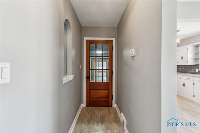 doorway featuring light hardwood / wood-style floors