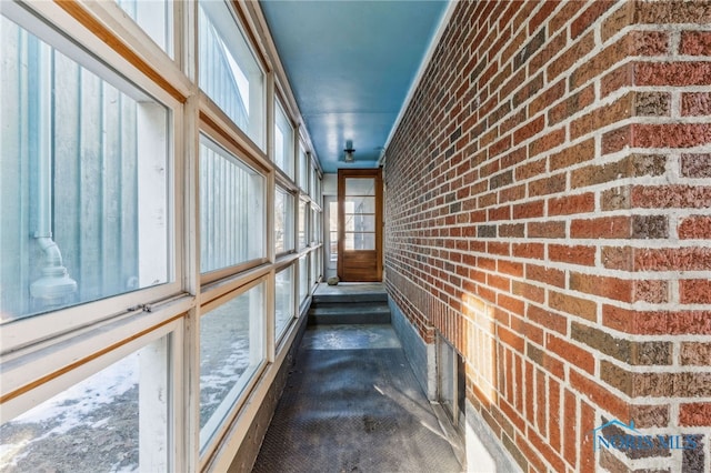 corridor with brick wall