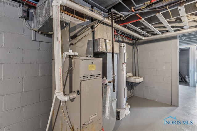 utility room with sink and electric water heater