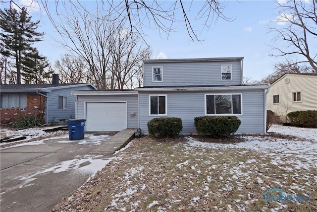 front of property with a garage