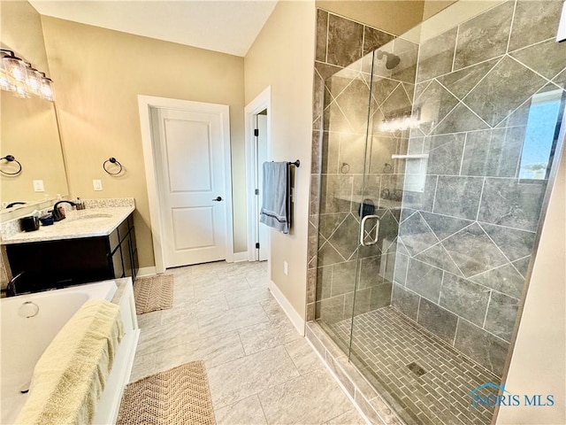 bathroom featuring vanity, plus walk in shower, and tile patterned flooring