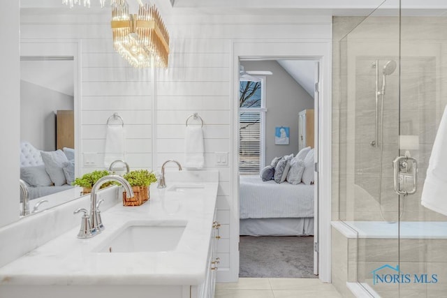 bathroom featuring tile patterned flooring, vanity, lofted ceiling, and a shower with shower door