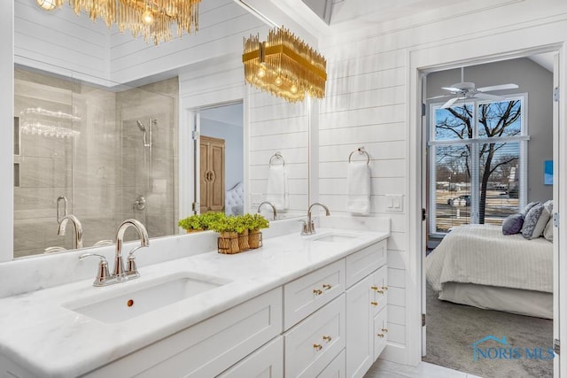 bathroom featuring an enclosed shower, vanity, ceiling fan, and wood walls