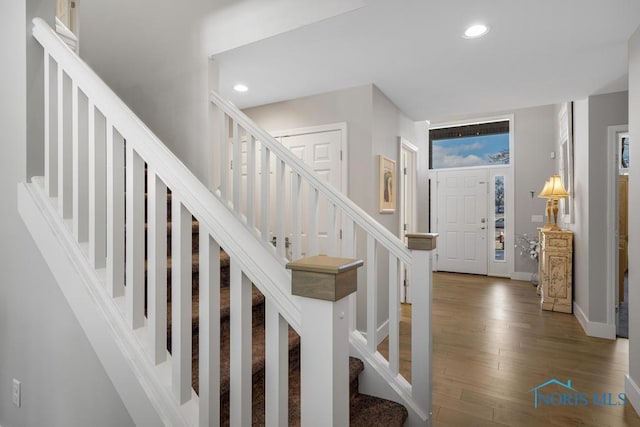 entryway with hardwood / wood-style flooring