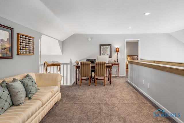 carpeted living room featuring lofted ceiling