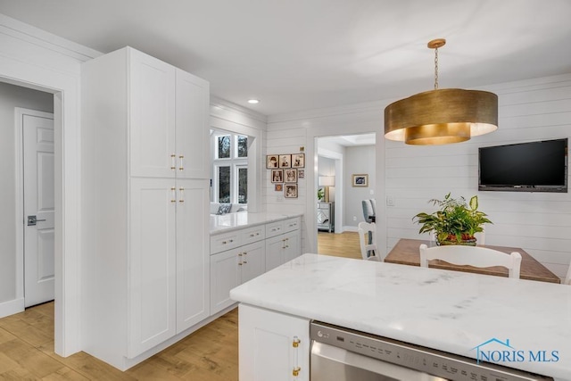 kitchen featuring hanging light fixtures, dishwasher, white cabinets, and light wood-type flooring