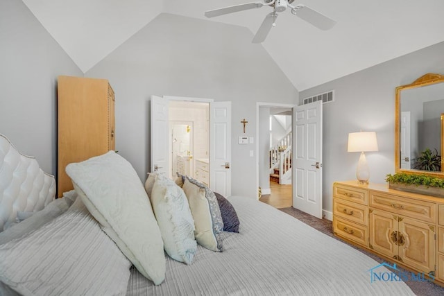 carpeted bedroom with ceiling fan, connected bathroom, and high vaulted ceiling