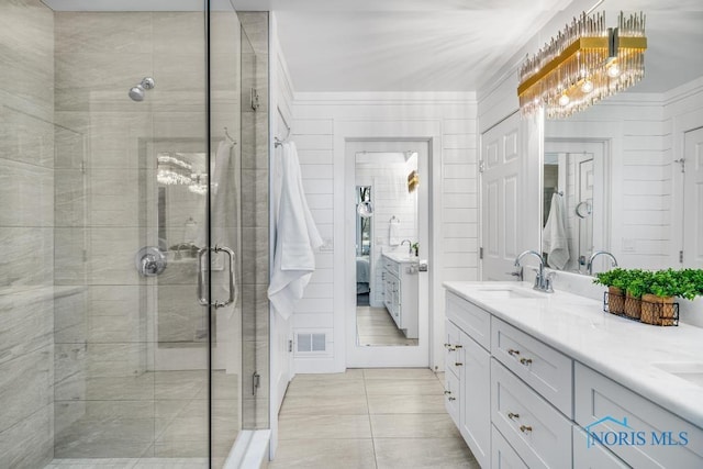 bathroom with vanity, tile patterned flooring, and walk in shower