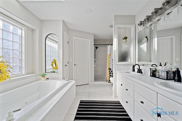 full bathroom with independent shower and bath, vanity, tile patterned floors, and toilet