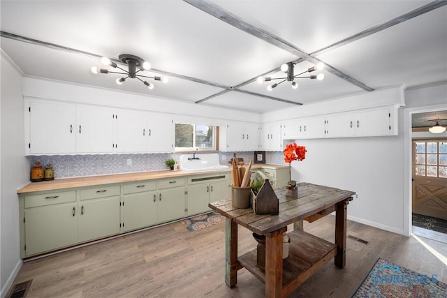 kitchen with a wealth of natural light, green cabinetry, and light wood-type flooring