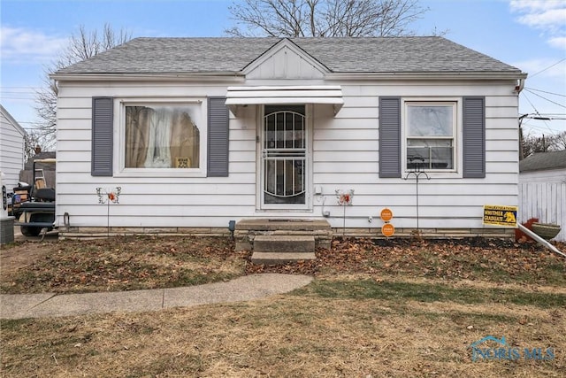 bungalow-style house with a front yard