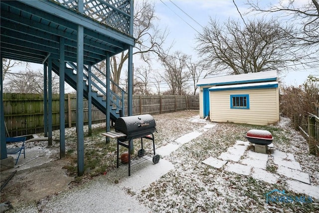 view of yard featuring a fire pit and an outdoor structure