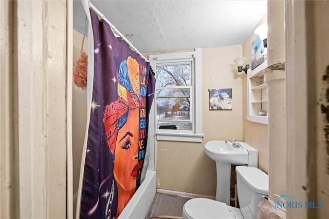 bathroom with shower / tub combo with curtain, toilet, and a textured ceiling