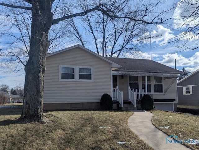 view of front of home with covered porch and a front yard